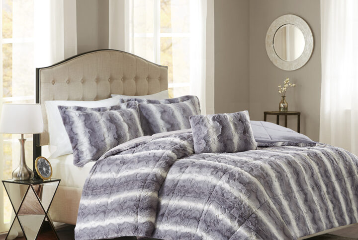 Snuggle up for a luxurious sleep with the Madison Park Zuri Comforter Set. This set features an ultra-soft faux fur front