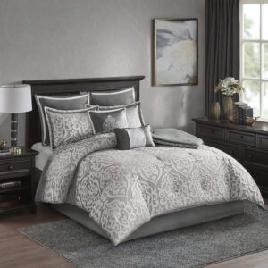 Add a touch of class to your bedroom with the Madison Park Odette 8 Piece Jacquard Comforter Set. The luxurious textured jacquard comforter and shams flaunt a gorgeous damask medallion design with silver striations on the satin ground that add dimension to the lavish look. A solid grey reverse and stunning Euro shams complement the top of the bed to complete the ensemble. Also included are two decorative pillows that feature embroidery and cording details