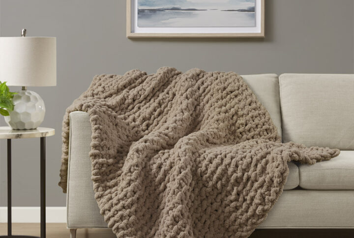 Indulge in pure comfort by wrapping yourself in the Madison Park Chenille Chunky Knit Throw. This chunky knit throw is handmade from luxurious chenille yarn to create a soft and cozy feel that's perfect to snuggle up in. The chunky knit throw is also OEKO-TEX certified