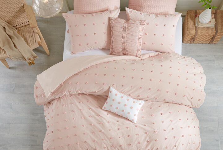 The Urban Habitat Brooklyn Cotton Jacquard Duvet Cover Set features small tufted chenille dots that create a fresh shabby chic look. This duvet cover set brings a soft and charming update to your bedroom