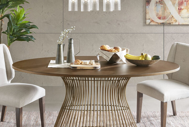 Add mid century modern to your dining room with the Mercer oval dining table.  Inspired by the iconic 60's silhouette with a modern twist of golden bronze tops and antique bronze wire frames for an updated look. Seats 6. Table will be shipped in 2 cartons. Assembly required.