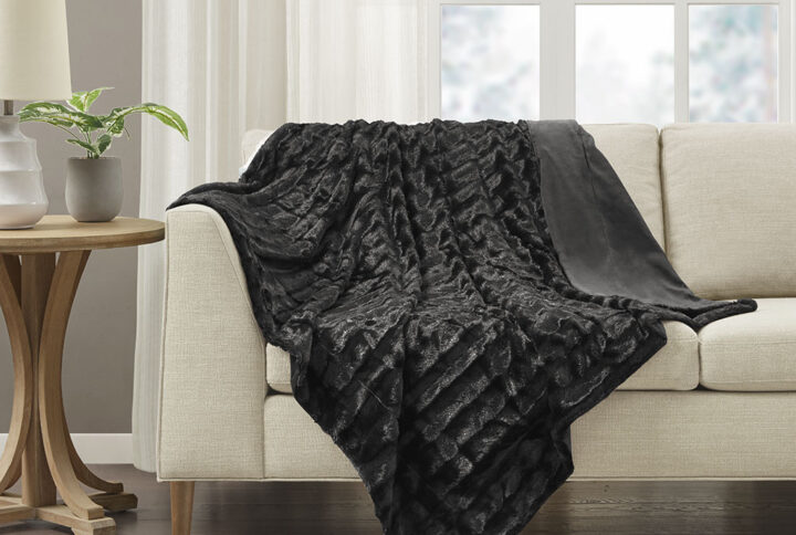 Wrap yourself in the lush comfort of the Madison Park Duke Long Fur Throw. The ultra-soft faux fur face provides comfort and coziness