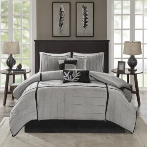 while maintaining a casual aesthetic. The grey colorway is accented with black micro-suede for a touch of contrast color. The reverse of the comforter is grey.