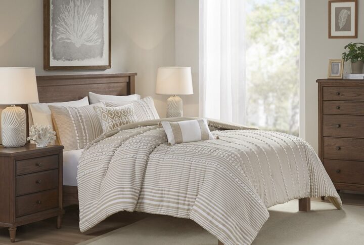 Update your bedroom with the casual beauty of the Harbor House Anslee Cotton Yarn Dyed 3 Piece Duvet Cover Set. This cotton yarn dyed duvet cover showcases stripes of various widths in soft taupe and white hues. Clip Jacquard detailing add alluring texture and dimension and flaunt a chic