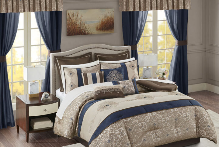 The Madison Park Essentials Delaney 24 Piece Room in a Bag offers a refined traditional update to your bedroom decor. The jacquard details flaunted on the pieced faux silk comforter