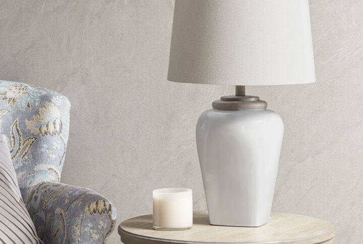 Illuminate your home with the charming style of the Martha Stewart Jemma Ceramic Table Lamp. Featuring a uniquely shaped white poly base and white tapered drum shade