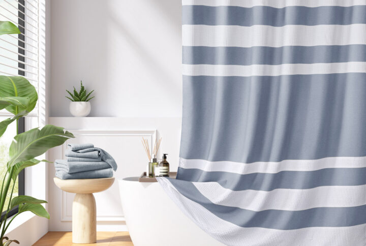 Update your space with the Madison Park Spa Waffle Shower Curtain with 3M Treatment. Featuring a fresh and updated stripe design