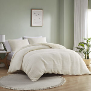 The Wyatt jersey duvet cover set features a unique knitted striped pattern in various widths for a modern look. Its soft texture and pieced heathered fabric add a casual and contemporary feel to your bedroom