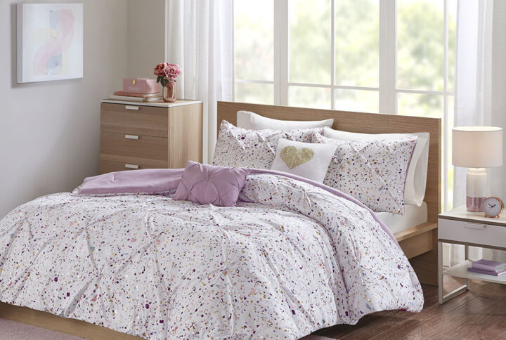 The Intelligent Design Abby Metallic Printed and Pintucked Comforter Set brings a fierce touch of glam to your bedroom. A vibrant metallic print in a plum hue and chic pintucking adorns the face of the comforter for a stunning look. The matching shams (1 in Twin/TwinXL) coordinate perfectly with the comforter