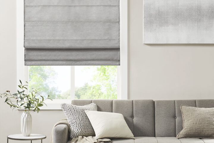 Our Madison Park Como Printed Faux Silk Room Darkening Cordless Roman Shade offers a modern and convenient update to your home decor. This roman shade flaunts a tonal grey faux silk textured fabric to create a stylish and beautiful