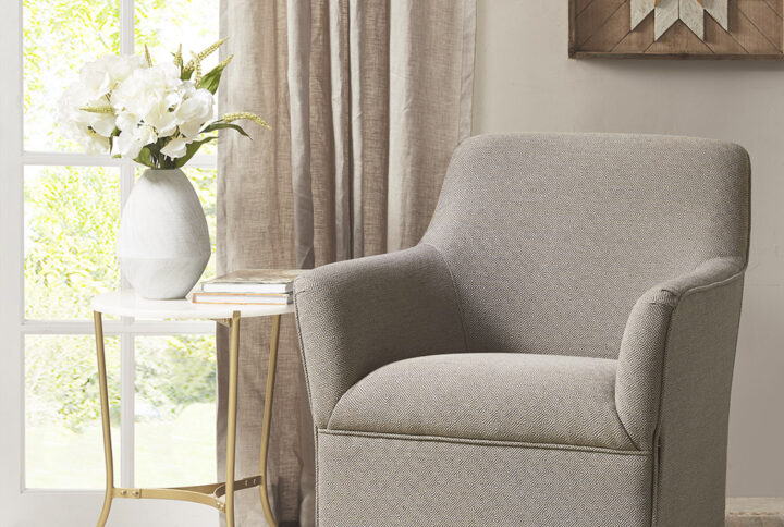 The Madison Park Augustine Swivel Glider Chair provides a simple and clean update to your living room decor. This swivel accent chair is upholstered in soft grey fabric that creates a smooth