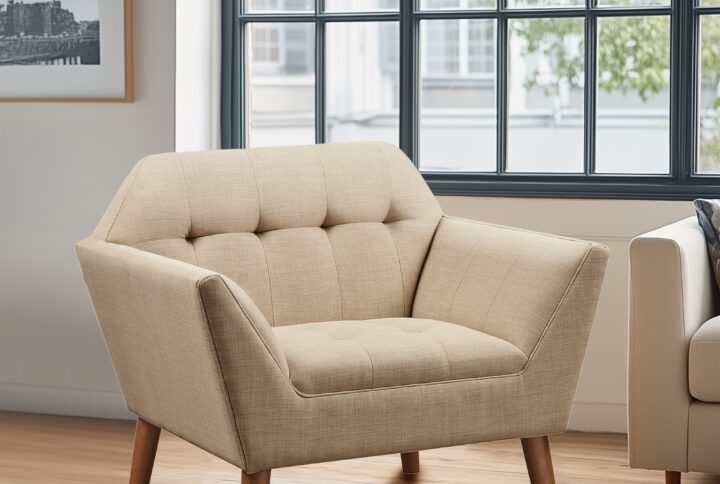 Elevate your living area with the mid-century allure of the INK+IVY Newport Upholstered Armchair. Featuring a wide 37-inch profile and a striking angular silhouette