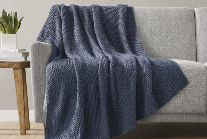 Bundle up in the warm and cozy comfort of the INK+IVY Bree Knit Throw. This ultra-soft