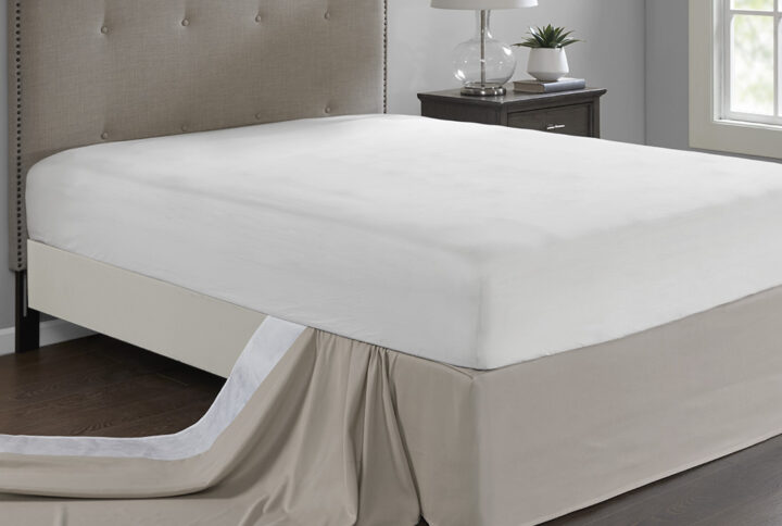 Give your bed the perfect finish with the Madison Park Simple Fit Wrap-Around Adjustable Bed Skirt. The solid khaki bed skirt features a hidden fabric band with a non-skid backing to keep it in place. Simply tuck and fold the bed skirt along the edge of the box spring to find the proper fit for your bed