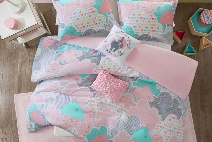 Drift off to dreamland with the whimsical charm of the Urban Habitat Kids Cloud Cotton Printed Duvet Cover Set. The duvet cover and shams (1 in Twin Sizes) showcase a cute and fluffy cloud motif in a soft colorful palette with a solid reverse. An oblong decorative pillow features all-over ruching and the square pillow features an embroidered unicorn. Made from 100% pre-shrunk cotton