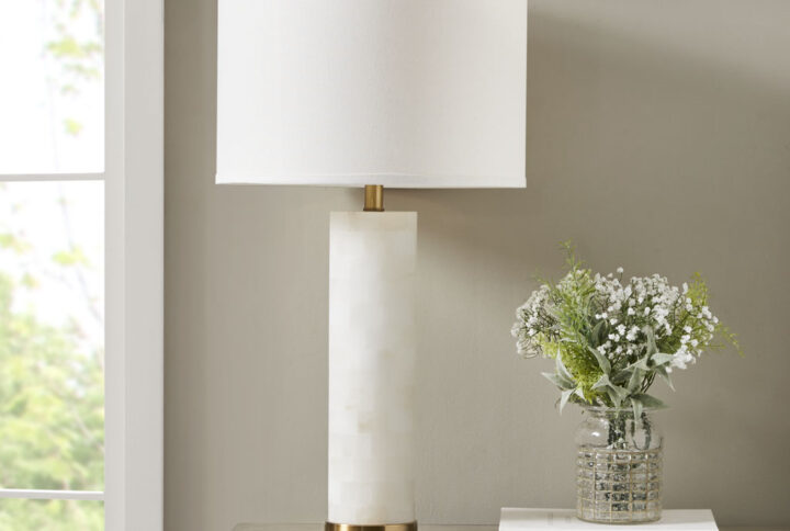 INK+IVY's Prague Alabaster Table Lamp brings a chic cultured look to your home. Made from a natural variation of white alabaster with a gold metal base