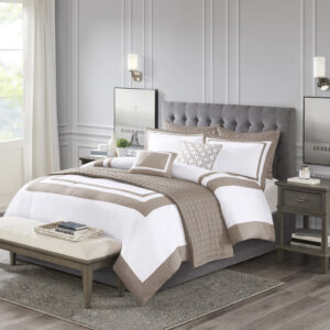 This Heritage hotel bedding collection includes a comforter and quilt that both come with matching shams to complete a luxurious layered look. The soft comforter and shams showcase a bold border on a white ground with a solid white reverse