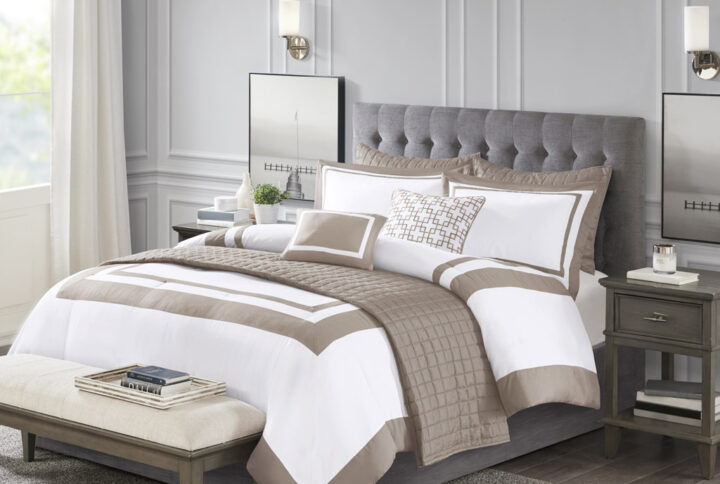 This Heritage hotel bedding collection includes a comforter and quilt that both come with matching shams to complete a luxurious layered look. The soft comforter and shams showcase a bold border on a white ground with a solid white reverse