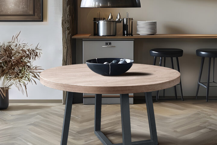 The Chapen Hill Reagan wheat wood veneer top and slate color legs offer a contemporary modern look to your eating area. This chick round table is 39" making it the perfect size for smaller spaces