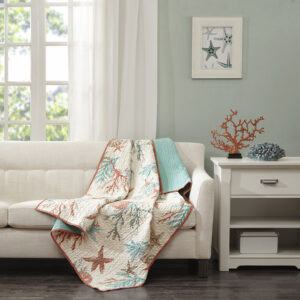 This Madison Park quilted throw creates a casual coastal look. The throw features starfish and coral motifs accentuated with coral and aqua colors and reverses to an aqua blue. It's oversized and overfilled for added comfort and style.