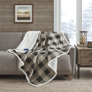 Stay warm and indulge in pure comfort with the Woolrich Linden Heated Throw. This tan heated throw features a soft mink face with a solid and cozy berber reverse that creates a luxurious look with an incredibly soft feel. The attached controller provides 3 different temperature settings to provide the perfect level of warmth that keeps you the most comfortable when bundled up. The controller also has a 2 hour auto shut off timer to ensure your safety during prolonged use. Machine washable for easy care