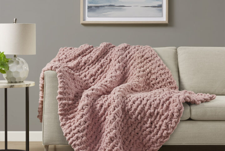 Indulge in pure comfort by wrapping yourself in the Madison Park Chenille Chunky Knit Throw. This chunky knit throw is handmade from luxurious chenille yarn to create a soft and cozy feel that's perfect to snuggle up in. The chunky knit throw is also OEKO-TEX certified