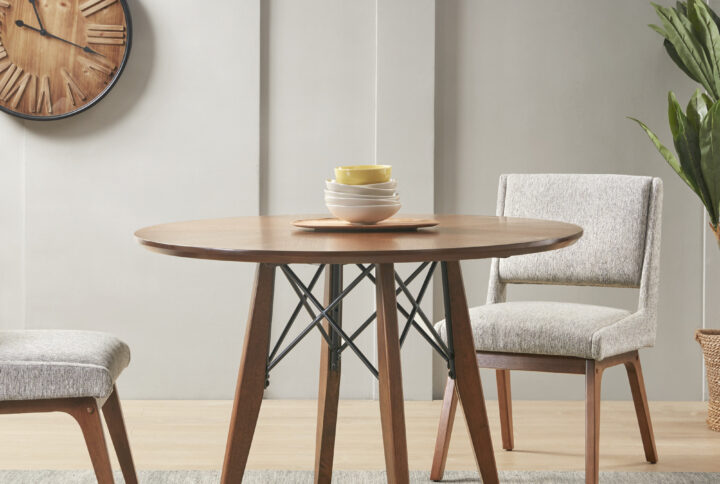 INK+IVY Clark Dining Set offers a warm and inviting update your dining room decor. This round dining table and upholstered chair set is perfect for a small dining nook. The table can be set up at either dining height or gathering height.