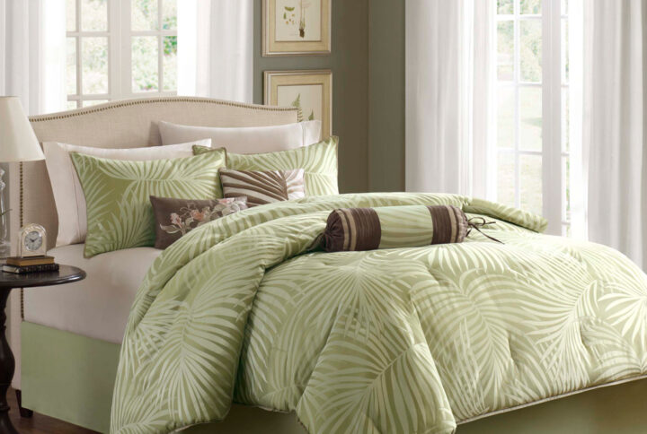 Transform your bedroom into a tropical oasis with the Madison Park Freeport 7 piece comforter set. This set showcases palm prints on polyester jacquard fabric in olive green and dark beige that create a relaxing vibe. The taupe piping lends a classy touch and the matching pillows accentuate the palm tree and floral motif. Three decorative pillows with embroidery and fabric manipulation details in contrasting colors of browns and taupe enhance the bed with texture and dimension. Machine washable for easy care.