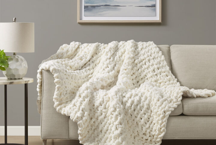 Indulge in pure comfort by wrapping yourself in the Madison Park Chenille Chunky Knit Throw. This chunky knit throw is handmade from luxurious chenille yarn to create a soft and cozy feel that's perfect to snuggle up in. The chunky knit throw is also OEKO-TEX certified