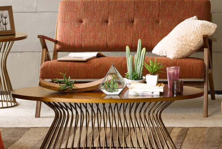 Add a touch of mid century modern to your living room with the Mercer coffee table. The table is inspired by the iconic 60's silhouette with a modern twist of  golden bronze tops and antique bronze wired frames for an updated look. Table will be shipped in 2 cartons. Assembly required.