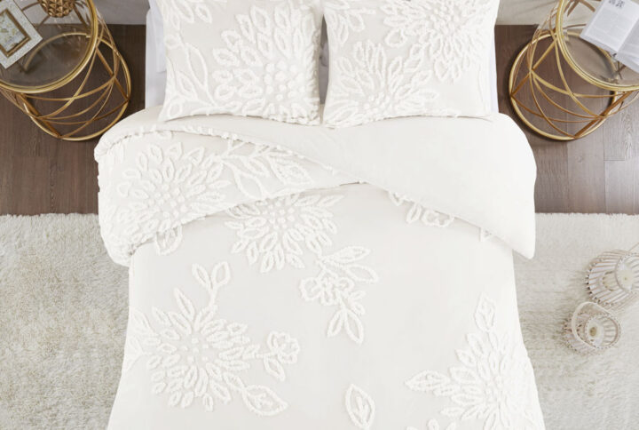 Complete your bedroom decor with the Madison Park Veronica 3 Piece Tufted Chenille Floral Duvet Cover Set. The shabby chic duvet cover features off white cotton tufted chenille floral pattern on a off white ground that creates a soft and cozy style. The 2 matching shams mirror the design of the duvet cover to complete the farmhouse aesthetic. Machine washable for easy care