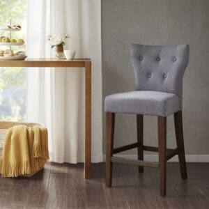 Change up your kitchen decor with the stunning style of the Madison Park Avila Tufted Back Counter Stool. This counter stool features a high button-tufted back upholstered in grey fabric