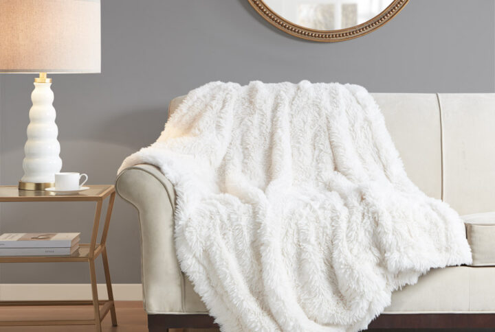 Add a glam touch to your room without sacrificing comfort with the Madison Park Haven Faux Fur Throw. This throw features a long faux fur face with a crystal velvet reverse