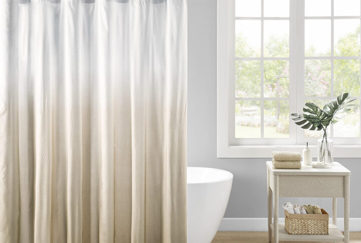 Add a refreshing touch to your bathroom decor with our Madison Park Ara Ombre Printed Seersucker Shower Curtain. This shower curtain features a taupe ombre print on an embossed seersucker fabric