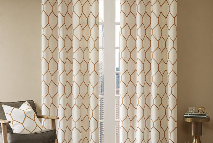 The Madison Park Brooklyn Window Panel provides a stylish and modern update for any room. A spice metallic geo pattern is embroidered on a natural textured fabric