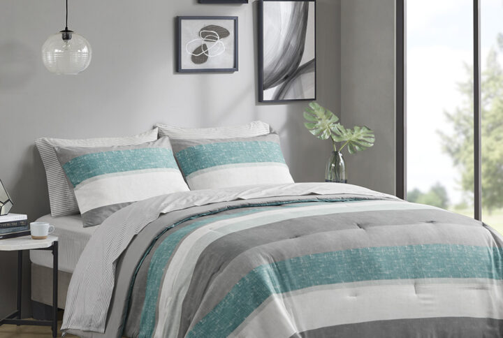 Revamp your bedroom style with the Madison Park Essentials Jaxon bed in a bag. This modern comforter set features a stripe pattern in alternating grey