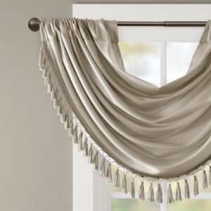 with our Elena Waterfall window valance. This classy champagne valance showcases rich center draping details and a beautiful tassel trim