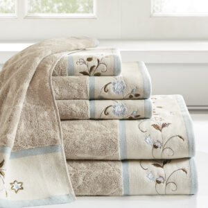 Add a touch of elegance to your bathroom decor with our Madison Park Serene Embroidered Cotton Jacquard 6 Piece Towel Set. These cotton towels feature a jacquard leaf pattern with a floral embroidered hem