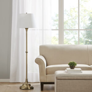 Add a touch of elegance to your living space with this beautiful Aelorian floor lamp from the Bedford collection by Martha Stewart. This classic lamp features an antique brass finish and an empire fabric shade in off-white color. The on/off rotary switch is on socket and the lamp plugs in