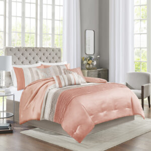 Amherst's modern color blocked design is a simple way to add style to your room. This comforter is covered in larges stripes in shades of coral and taupe. Made from polyester jacquard and a brushed fabric reverse this comforter is soft to the touch and is machine washable for easy care. The comforter set includes two matching standard shams and three decorative pillows that accent the color blocked look.