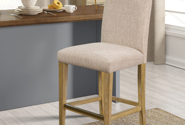 Outfit your dining decor with the simple refinement of the Martha Stewart Connor Counter Stool. Featuring a medium-high upholstered back and cushioned seat