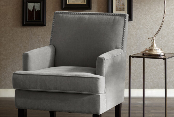 The Madison Park Colton Track Arm Club Chair brings a simple and sharp update to your home decor. This accent club chair features a sleek design with track arms and a nailhead trim along the back and sides