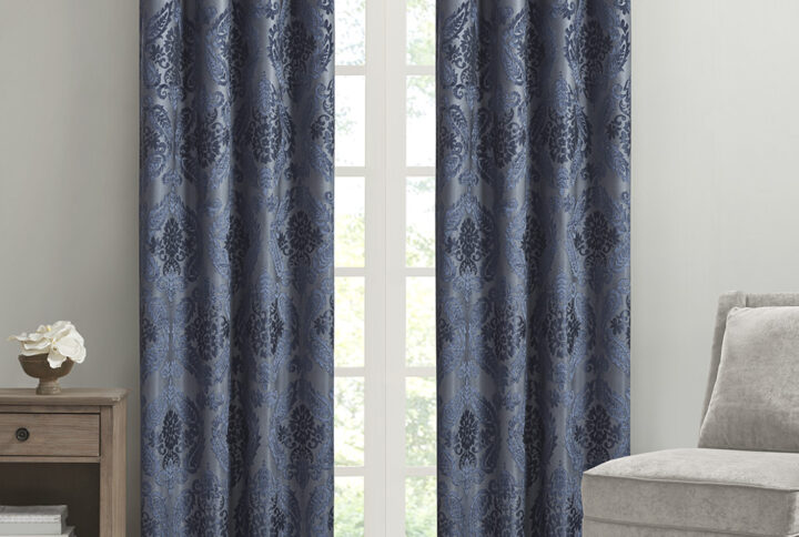 Our SunSmart Amelia Knitted Jacquard Paisley Total Blackout Grommet Top Curtain Panel adds the perfect touch of traditional elegance to your home. This total blackout navy curtain features an intricate paisley design on a heavy textured jacquard fabric