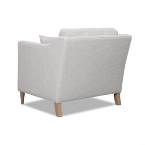 this accent chair showcases a simple design with high track arms and a removable seat cushion that provides exceptional comfort. The solid wood legs feature a Oat finish