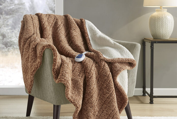 Combine fashion and function seamlessly with this heated throw that will keep you warm and cozy during chilly nights. The sherpa material features a variegated color pattern on front for added style and reverses to a solid sherpa. Three heat settings allow you to easily customize your comfort level to perfection