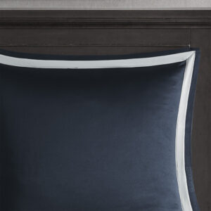 while a solid navy bed skirt provides a clean and elegant finish. Overfilled for superior warmth and comfort