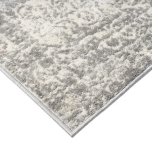 this area rug features a boho-inspired medallion pattern in soft shades of cream and grey for a traditional