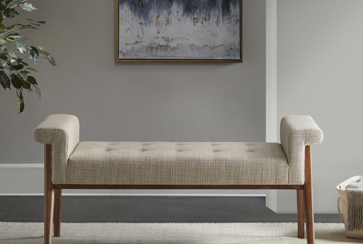 Elevate your living room or bedroom with the INK+IVY Mason Accent Bench. This accent bench features a button tufted seat and key arms that are upholstered in a soft tan fabric