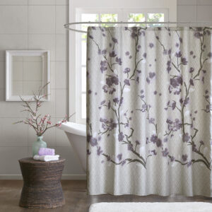 Put a modern touch on your decor with the Madison Park Holly Collection. This 100% cotton shower curtain features an allover cherry blossom design with branches. The soft grey background pairs beautifully with the purple and grey flowers for the perfect update to your space. Machine washable for easy care