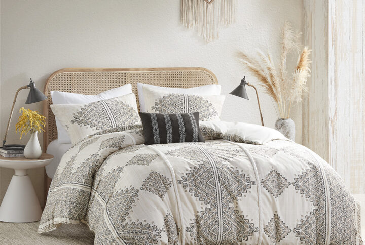 This soft microfiber artisan duvet cover set displays a printed global inspired design